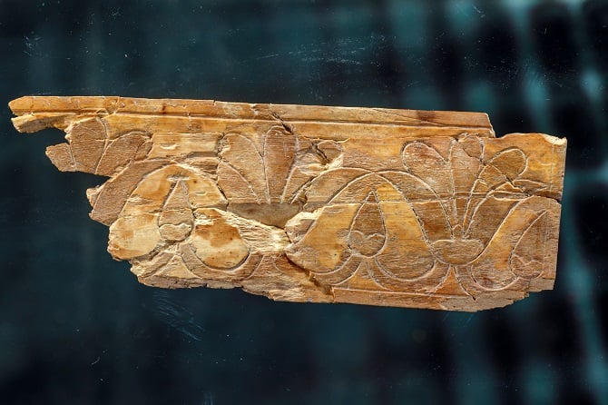 An ivory plate decorated with the lotus flower.