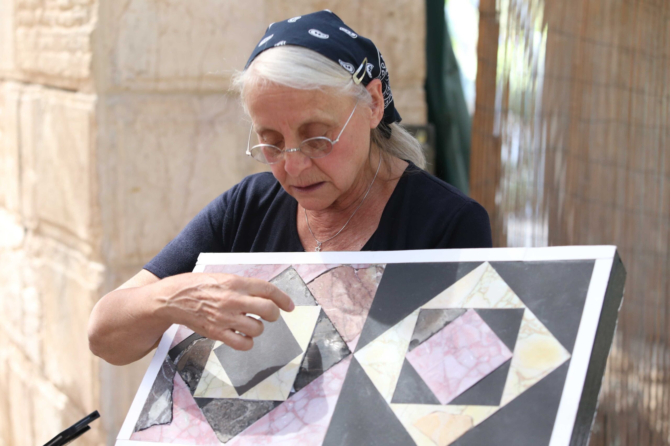 Frankie Schneider presents the restoration of the temple tiles. Photo: Moshe Mangan