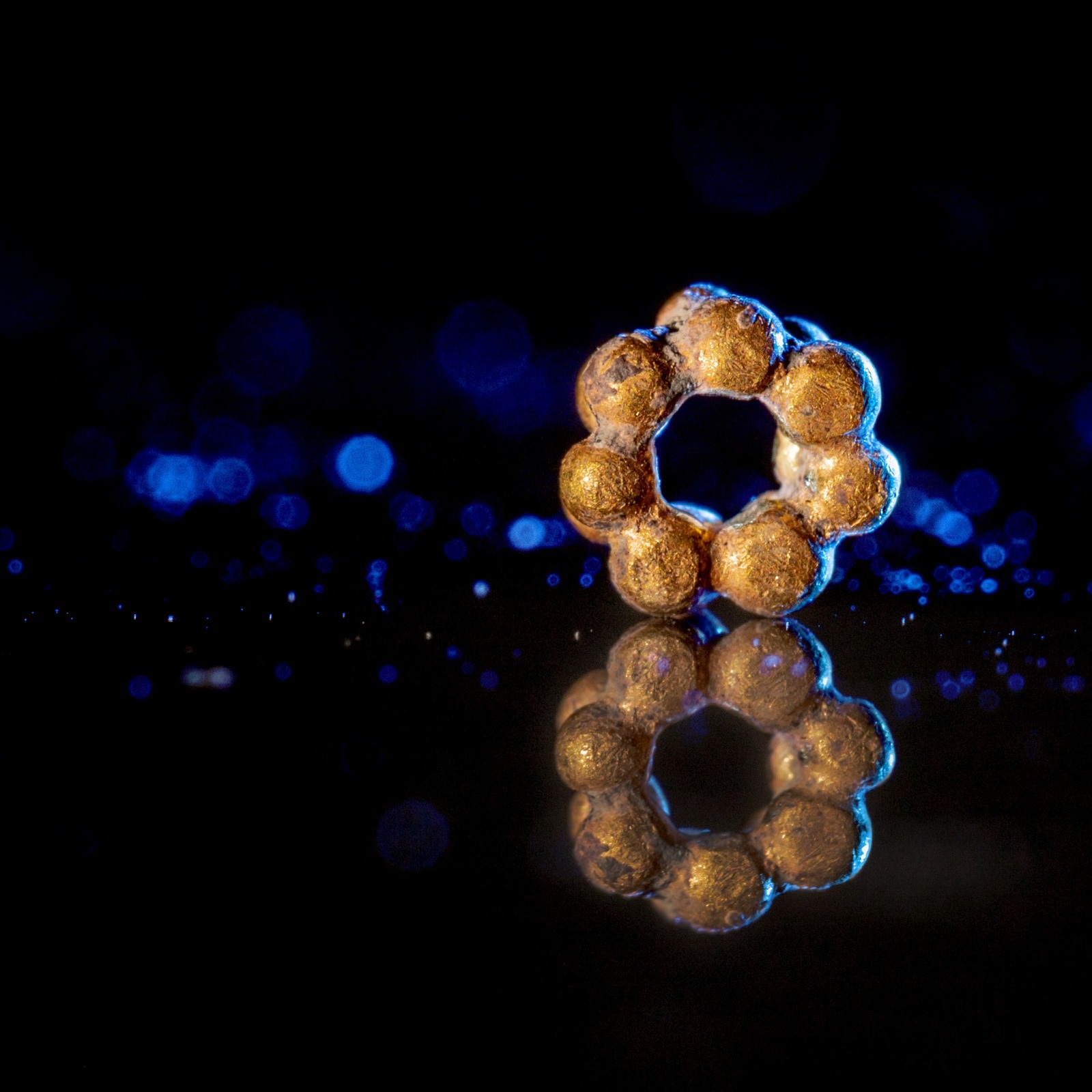 The gold bead which was discovered in Israel Antiquities Authority excavations in the City of David. Credit: Koby Harati, City of David